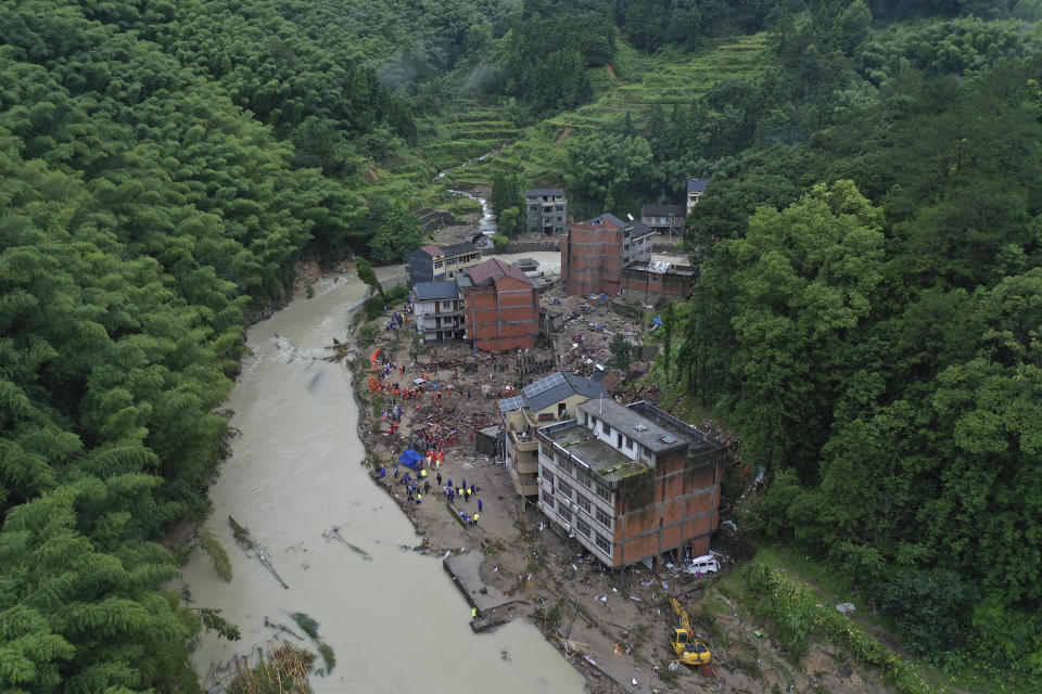 Rescuers search for victims of a landslide triggered by Typhoon Lekima in Yongjia county in eastern China's Zhejiang province on Saturday, Aug. 10, 2019. The official Xinhua News Agency says more than 1 million people were evacuated in coastal Zhejiang province before the typhoon hit land at 1:45 a.m. on Saturday (Chinatopix Via AP)