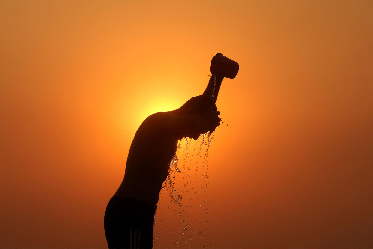 Heat Wave India silhouette MUKESH GUPTA/AFP via Getty Images