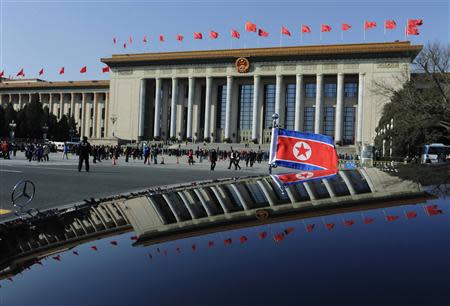 A Mercedes car with a North Korean flag is seen outside the Great Hall of the People at Tiananmen Square during the opening session of National People's Congress (NPC), in Beijing, March 5, 2014. REUTERS/Stringer