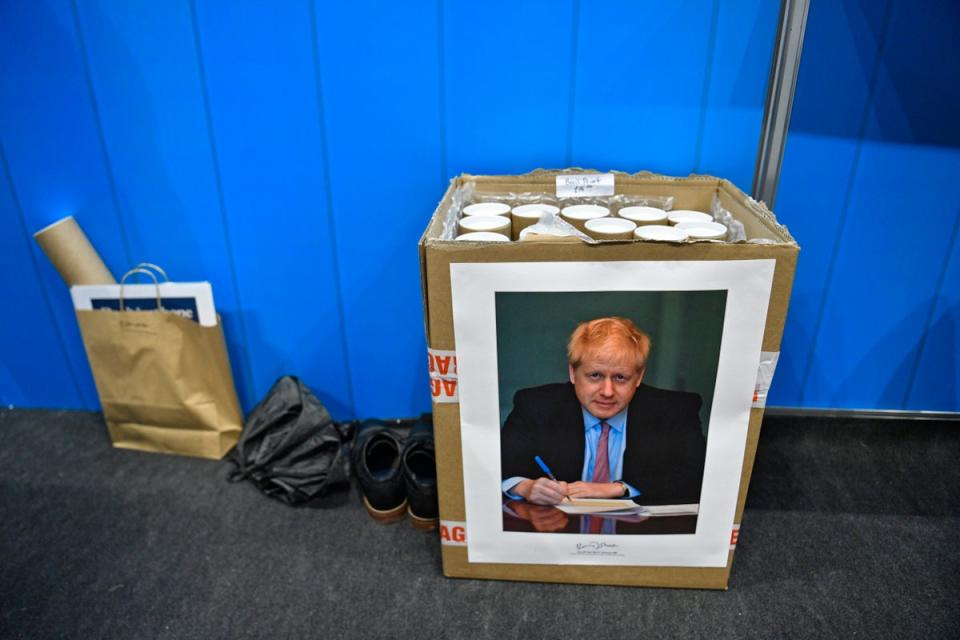 Boris Johnson posters for sale at the Conservative Party Conference in Manchester on 29 September (EPA)