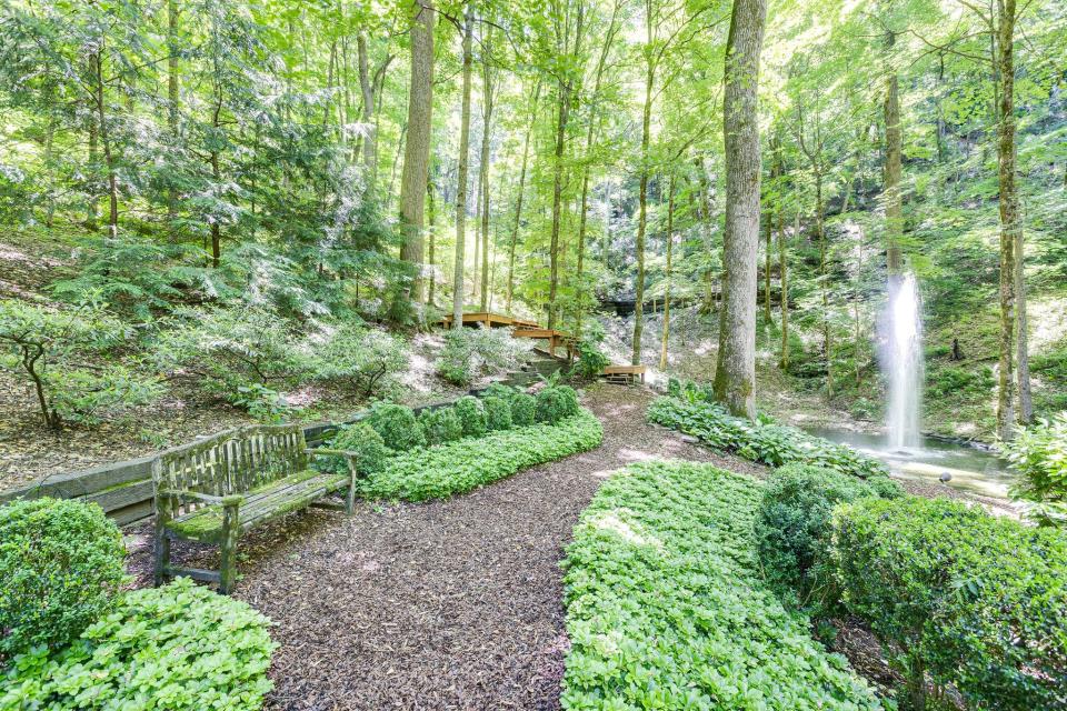 The property is landscaped with trails, a pond, and a fountain at 62 Annandale in Nashville.