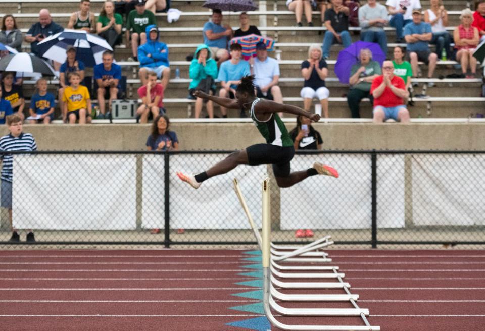 North’s Angelo St. Louis clears a hurdle in the 300 meter hurdles event of the IHSAA Boys Track and Field sectional 32 at Central High School in Evansville, Ind., Thursday, May 19, 2022. 