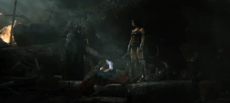 Batman and Wonder Woman standing next to Lois as she weeps over Superman's corpse in "Batman v Superman: Dawn of Justice"