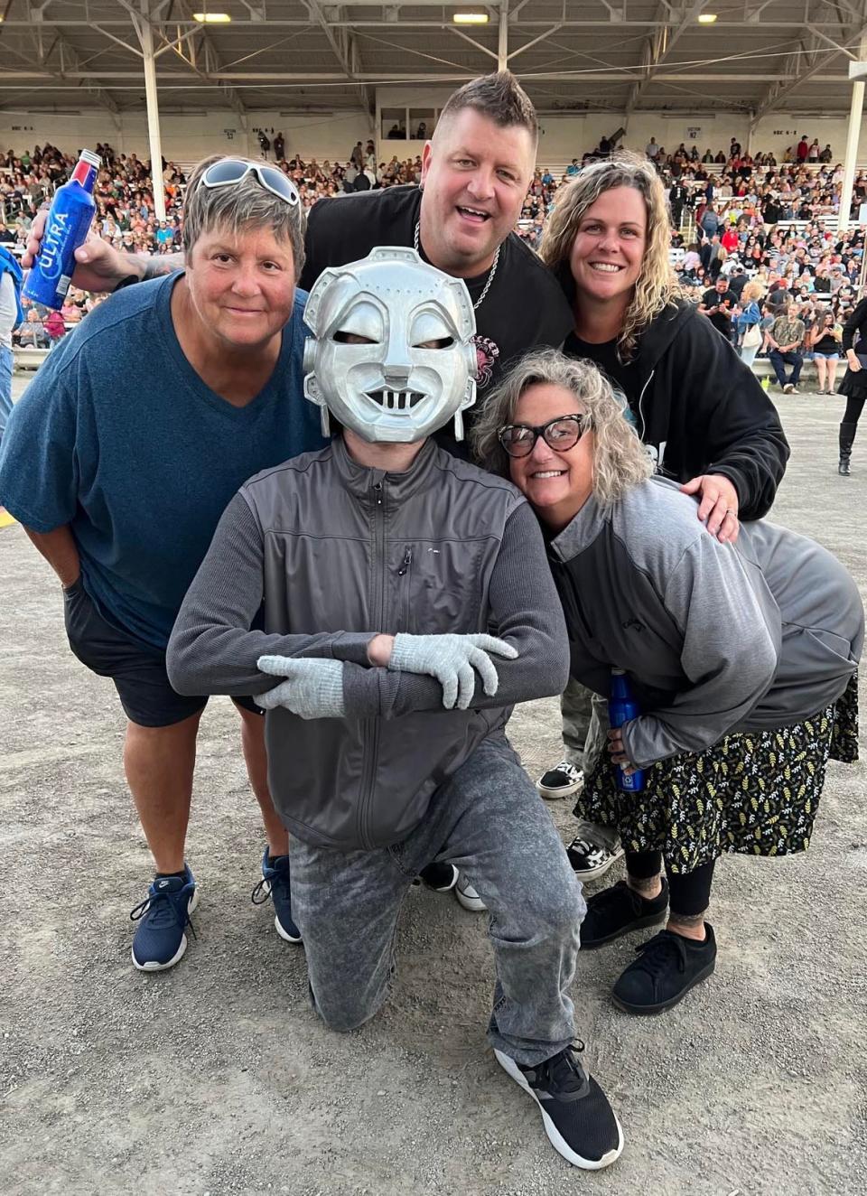 Cohlman Arthur, 18, of Cuyahoga Falls, wears what he called his "Mr. Roboto" mask, a reference to a popular 1980s song and MTV video by Styx. Arthur attended Thursday night's Styx concert at the Stark County Fair.