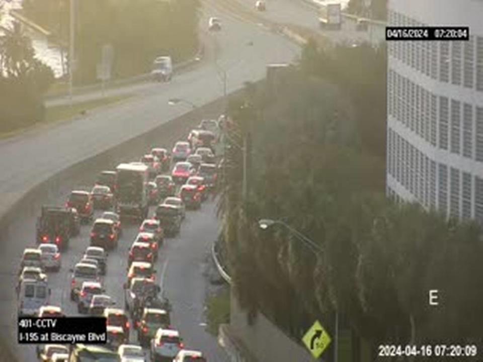 The traffic on the Interstate 195 spur route as it becomes the Julia Tuttle Causeway. The rollover crash is hidden by the building. Florida Department of Transportation