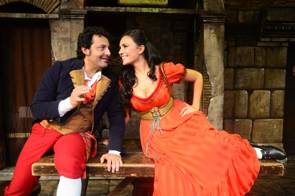 This undated image released by Michelle Tabnick Communications shows Italian comedian Enrico Brignano, left, and actress Serena Rossi in character from “Rugantino,” one of Italy’s most successful musicals. Producers said Monday, March 17, 2014, that the production celebrating the show’s 50th anniversary of its Broadway debut will play New York City Center this June starring Italian comedian Enrico Brignano. (AP Photo/Michelle Tabnick Communications)