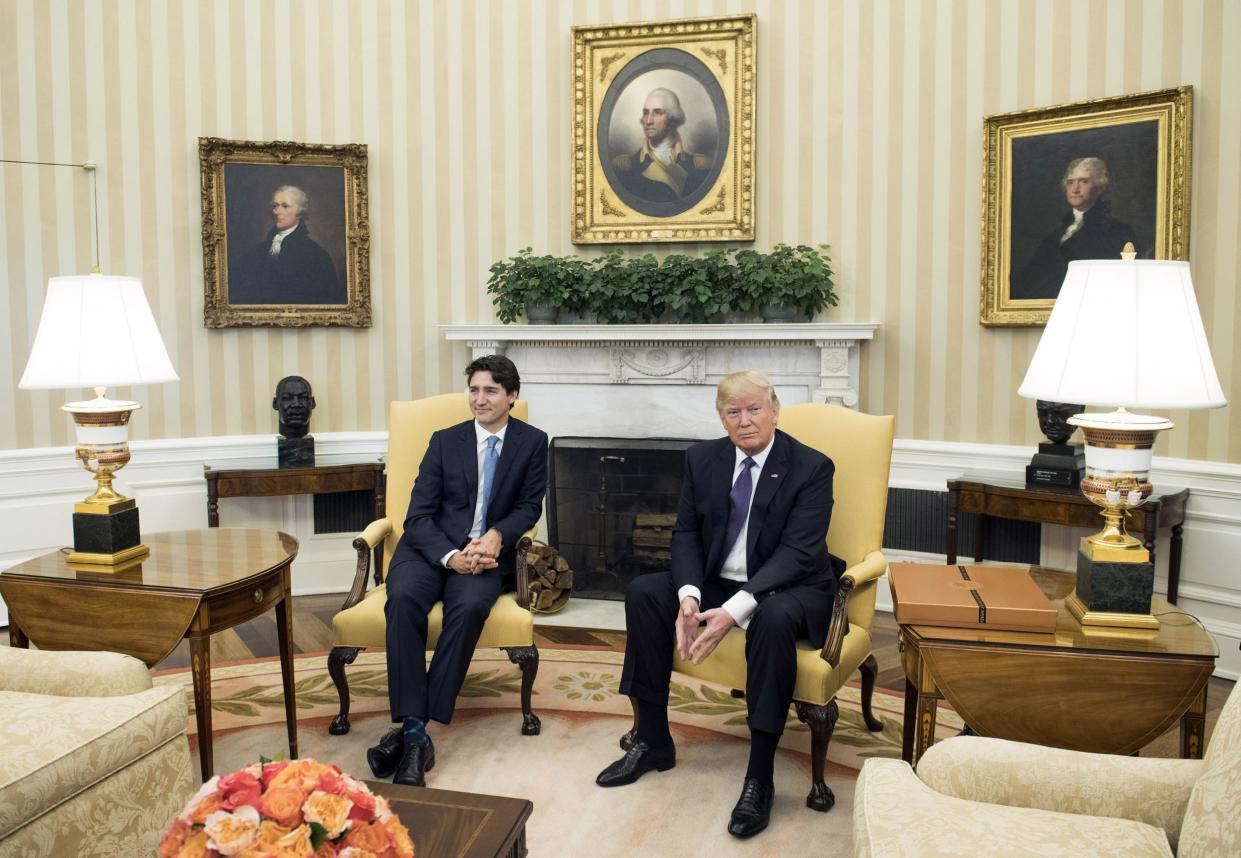 Mr Trudeau and Mr Trump in the Oval Office during the photoshoot: Getty