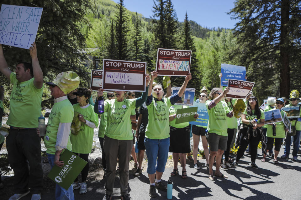 Protestors gather on the Gore Creek Recreation Path to protest Secretary of the Interior David Bernhardt on the first day of the annual Western Governors' Association meeting Monday, June 10, 2019, in Vail, Colo. Put on through the Sierra Club of Colorado, the protestors were trying to get Bernhardt's attention, who is keynoting the first day of the conference. (Chris Dillmann/Vail Daily via AP)