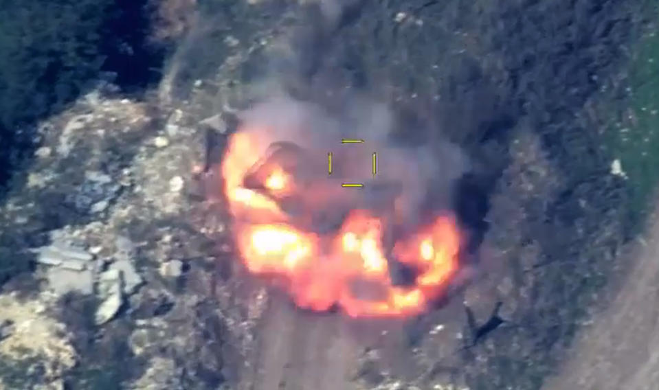 In this photo taken from video released by Defense Ministry of Azerbaijan on Tuesday, Sept. 19, 2023, explosion flame rises over an area which Azerbaijan says hosts Armenian forces' positions in the breakaway territory of Nagorno-Karabakh in Azerbaijan. Azerbaijan on Tuesday declared that it started what it called an "anti-terrorist operation" targeting Armenian military positions in the Nagorno-Karabakh region and officials in that region said there was heavy artillery firing around its capital. (Defense Ministry of Azerbaijan via AP)