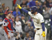 Milwaukee Brewers' Rhys Hoskins reacts after hitting a home run during the fourth inning of a baseball game against the Minnesota Twins, Wednesday, April 3, 2024, in Milwaukee. (AP Photo/Jeffrey Phelps)