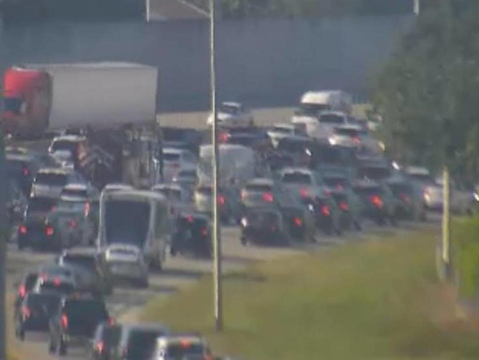 Slow traffic creeps along the northbound lanes of the Florida Turnpike near Kendall Drive on Friday evening, May 24, 2024, due to an overturned tanker truck.