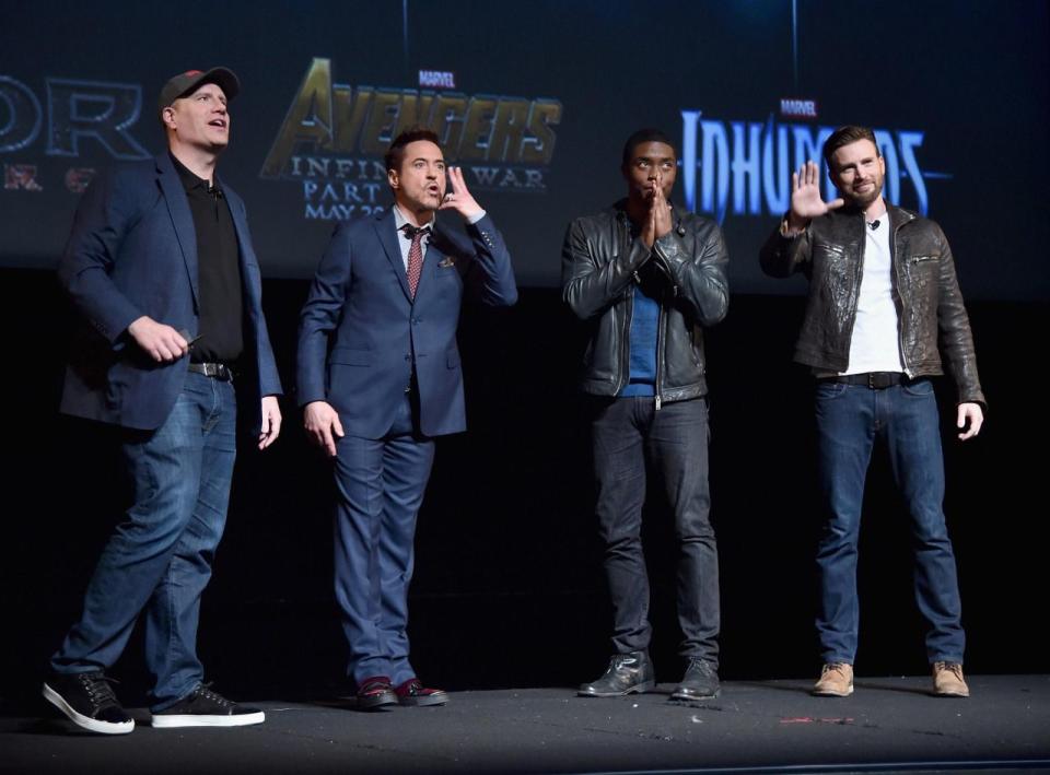 Kevin Feige, Robert Downey Jr., Chadwick Boseman and Chris Evans at the Oct. 28, 2014 press event that introduced Boseman as the Marvel Cinematic Universe's Black Panther. (Photo Getty/Disney/Marvel) 