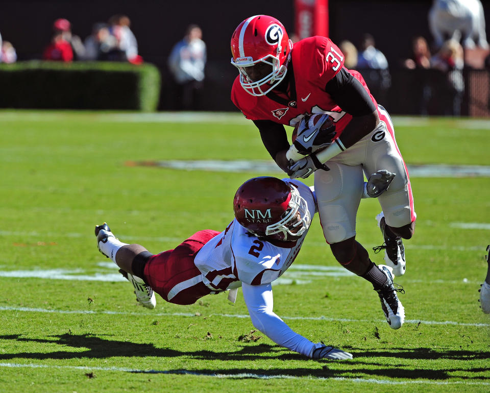 ATHENS, GA - NOVEMBER 5: Chris Conley #31 of the Georgia Bulldogs carries the ball against Ben Bradley #2 of the New Mexico State Aggies at Sanford Stadium on November 5, 2011 in Athens, Georgia. Photo by Scott Cunningham/Getty Images)