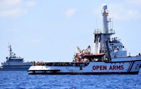 Spanish migrant rescue ship Open Arms is seen close to the Italian shore in Lampedusa