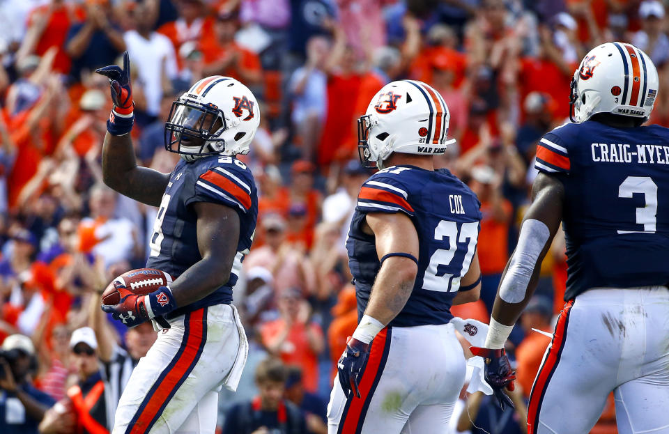 Auburn running back JaTarvious Whitlow (28) celebrates after scoring a touchdown during the first half of an NCAA college football game against LSU, Saturday, Sept. 15, 2018, in Auburn, Ala. (AP Photo/Butch Dill)
