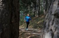 Kosovo's 400 metres runner Vijona Kryeziu runs in the woods of the village Rogane in Kamenica, Kosovo, July 30, 2016. Kryeziu trains in the woods because there was no athletics stadium nearby. The Rio Games will be the first to host athletes competing under the flag of Kosovo. REUTERS/Hazir Reka