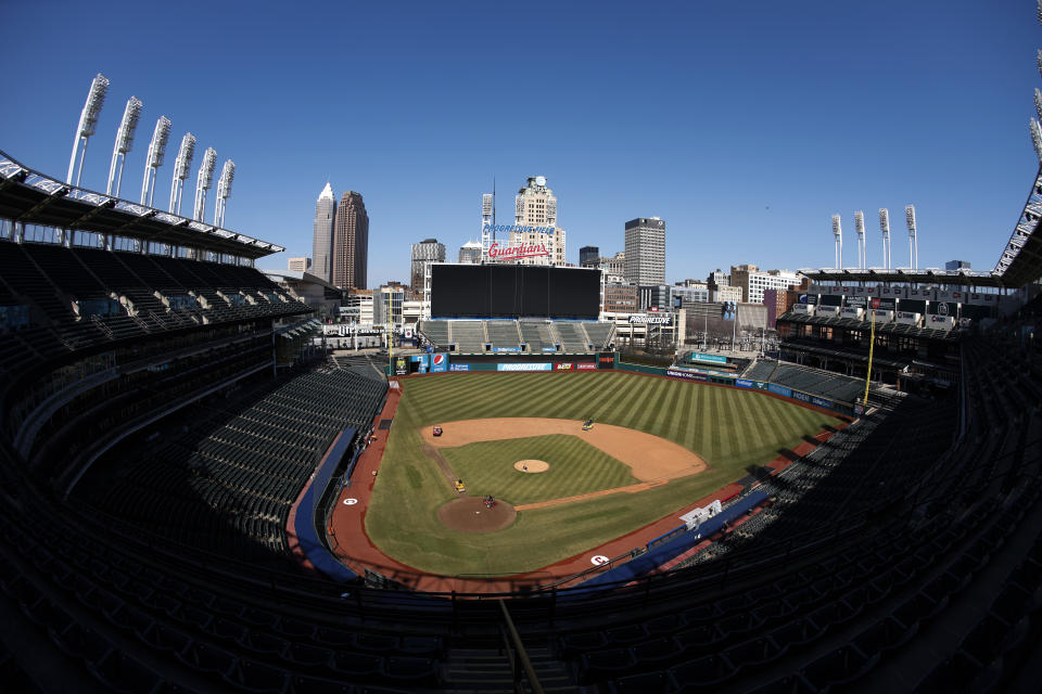 FILE - Workers finish installing the Cleveland Guardians sign above the scoreboard at Progressive Field, Thursday, March 17, 2022, in Cleveland. On Friday, April 15, the renamed Guardians will play for the first time at Progressive Field, officially launching a new era for a team known as the Indians since 1915 before a long-debated and fan-dividing name change finally happened last year.(AP Photo/Ron Schwane, File)