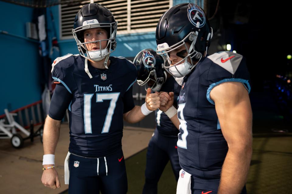 Tennessee Titans quarterback Ryan Tannehill (17), quarterback Malik Willis (7), and quarterback Will Levis (8) huddle before a game against the Indianapolis Colts.