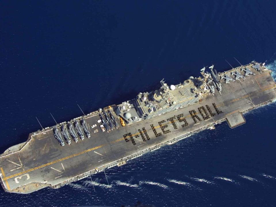 More than 500 Marines and Sailors spell out the now famous quote from Todd Beamer, on the flight deck of a ship on 6 September, 2002 (Getty Images)