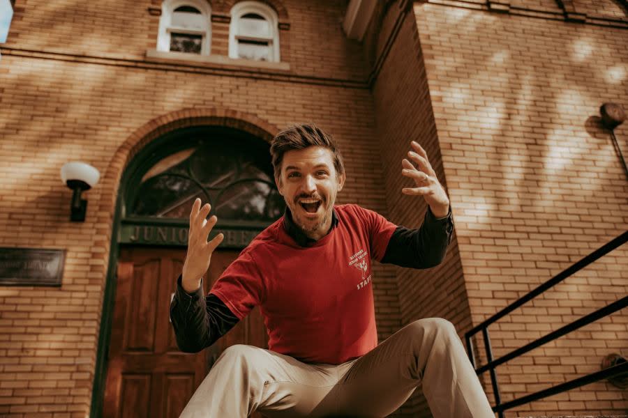 Daniel Sheridan, a DJT, alum, at the entrance to the Mary Fluhrer Nighswander Theatre.