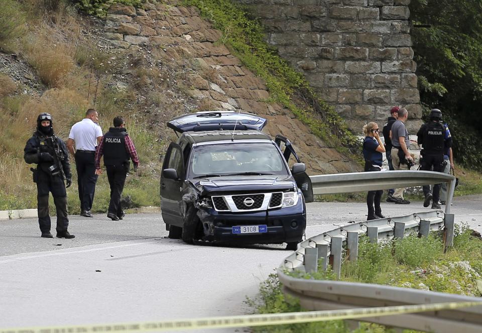 European Union police officers secure the site near Kosovo's town of Zvecan where one of their colleagues was shot dead, September 19, 2013. A European Union police officer in Kosovo was shot dead on Thursday in a northern, mainly Serb region where tensions are rising over a fragile accord between the Balkan country and its former master Serbia. It appeared to mark the first fatality suffered by the EU mission, known as EULEX, since it deployed in 2008 after majority-Albanian Kosovo declared independence from Serbia with the backing of the West. REUTERS/Bojan Slavkovic (KOSOVO - Tags: CIVIL UNREST POLITICS)