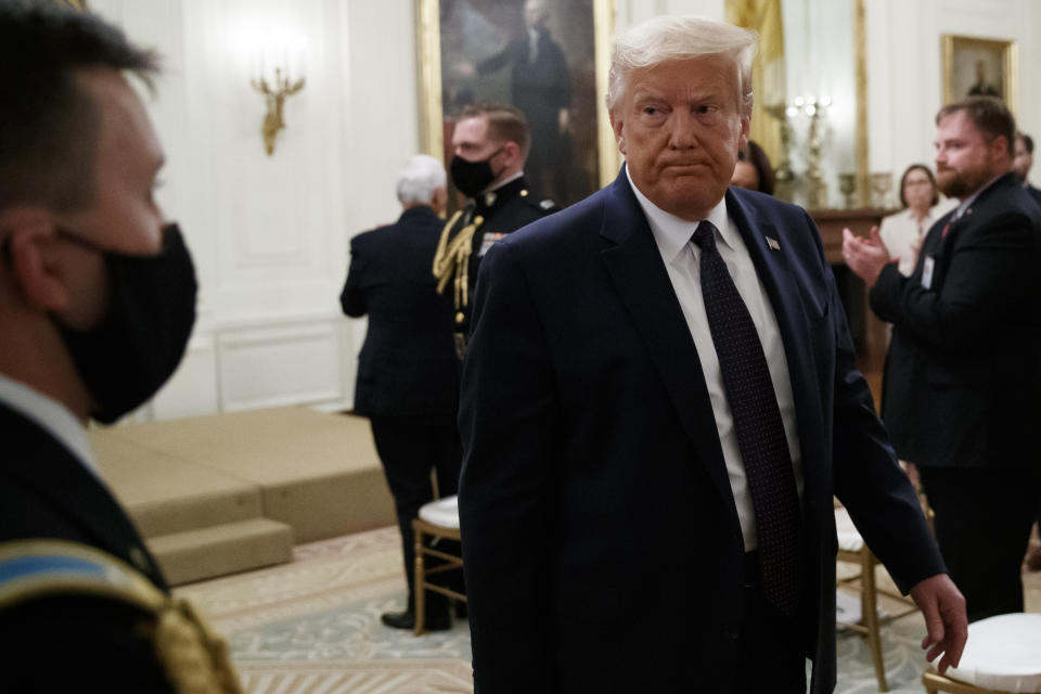 FILE - In this June 17, 2020, file photo President Donald Trump departs after speaking about the PREVENTS "President's Roadmap to Empower Veterans and End a National Tragedy of Suicide," task force, in the East Room of the White House in Washington. The relationship between the nation's military community and the Republican president has been strained repeatedly over the course of Trump's turbulent first term. (AP Photo/Alex Brandon, File)