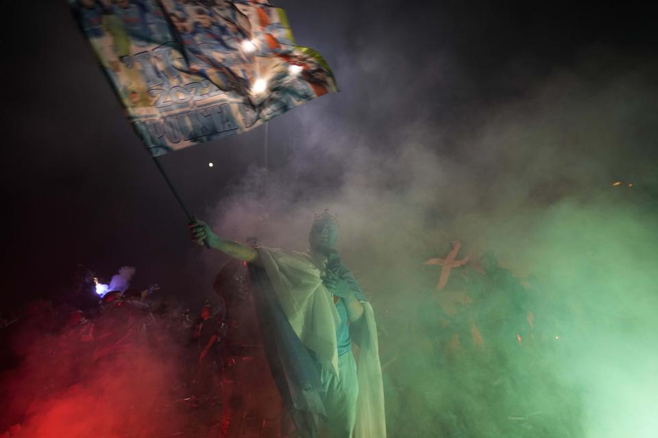 Napoli fans celebrates after winning the Italian league soccer title, in Naples, Italy, Thursday, May 4, 2023. (AP Photo/Andrew Medichini)