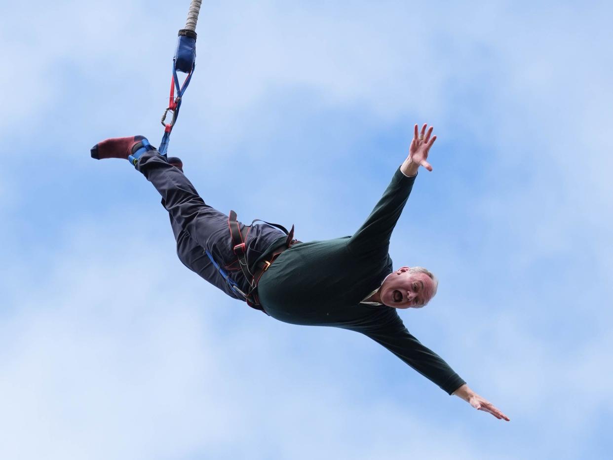 Liberal Democrat leader Sir Ed Davey taking part in a bungee jump during a visit to Eastbourne Borough Football Club in East Sussex, while on the General Election campaign trail. Picture date: Monday July 1, 2024.