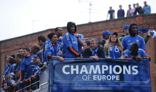Chelsea football club's Russian owner Roman Abramovich (front centre) sits amongst Chelsea players as they parade through London following their 2012 FA Cup and Champions League victory. Andre Villas Boas's bitterness at his sacking by Chelsea last season surfaced again on Sunday as he said his new club Spurs did not seek out scapegoats if they were going through a bad patch