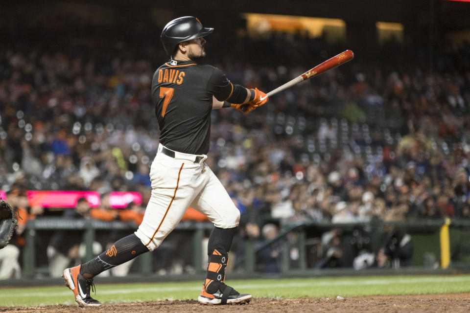 San Francisco Giants' J.D. Davis hits an RBI double against the Los Angeles Dodgers during the eighth inning of a baseball game in San Francisco, Sunday Sept. 18, 2022. (AP Photo/John Hefti)