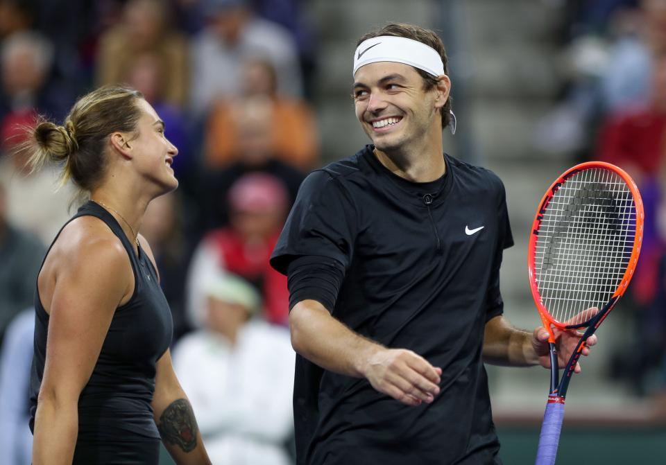 Taylor Fritz and Arnya Sabalenka celebrate a win during a match in the Tie Break Tens event in the Eisenhower Cup in Indian Wells, Calif., March 7, 2023. 