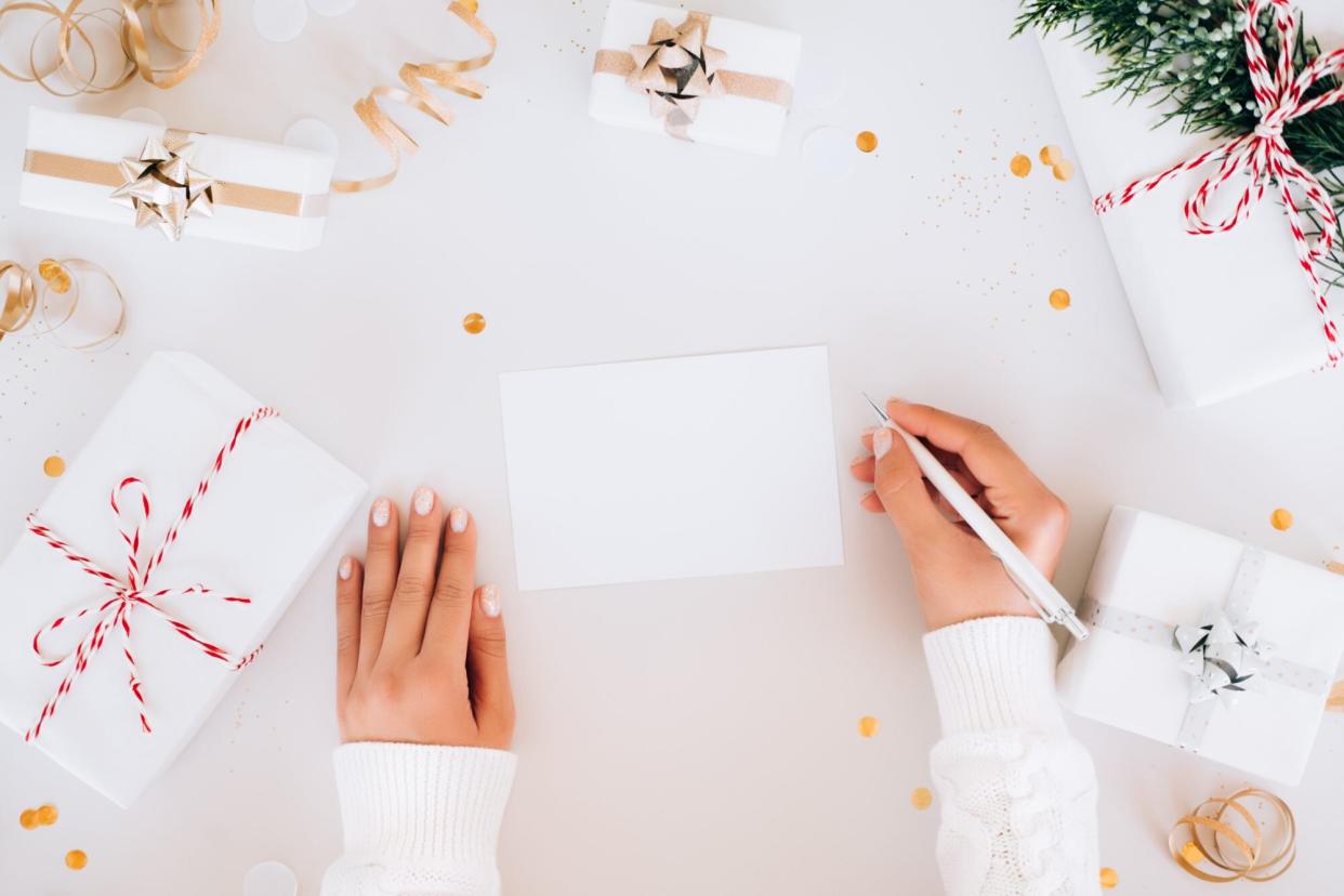 Woman writing a Christmas card