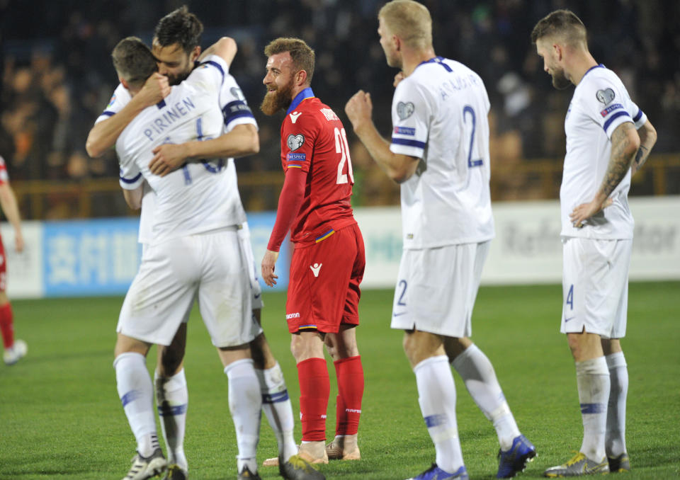 Finland players celebrate their 2-0 victory in the Euro 2020 group J qualifying soccer match between Armenia and Finland at the Vazgen Sargsyan Republican stadium in Yerevan, Armenia, Tuesday, March 26, 2019. (AP Photo/Hakob Berberyan)