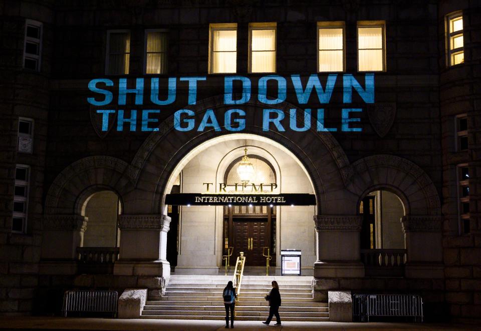 Activists from the Population Connection Action Fund project a protest message onto the Trump International Hotel in Washington on Jan. 23, 2019. (Photo: Andrew Caballero-Reynolds/AFP via Getty Images)