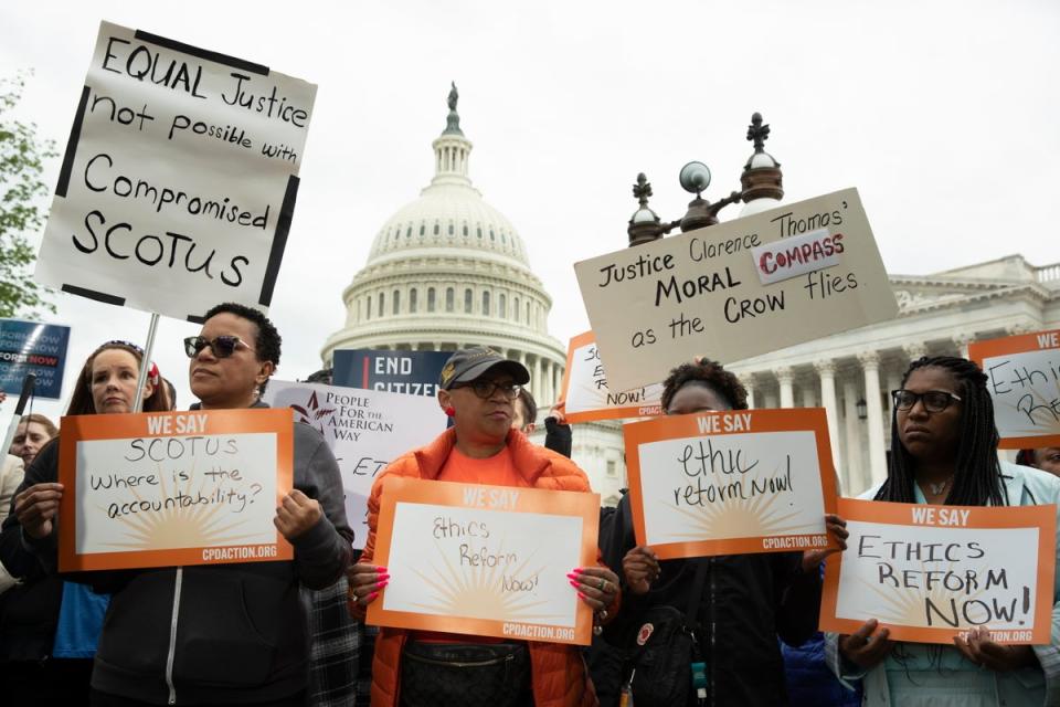 Protesters in Washington DC join  rally pushing for Supreme Court ethics rules and the end of Citizen United as lawmakers debate codes of conduct on 2 May (EPA)