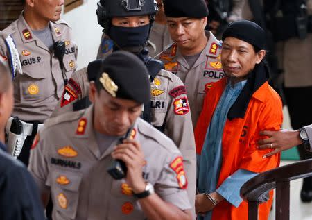 Islamic cleric Aman Abdurrahman arrives at a court ahead of his verdict in Jakarta, Indonesia, June 22, 2018. REUTERS/Darren Whiteside