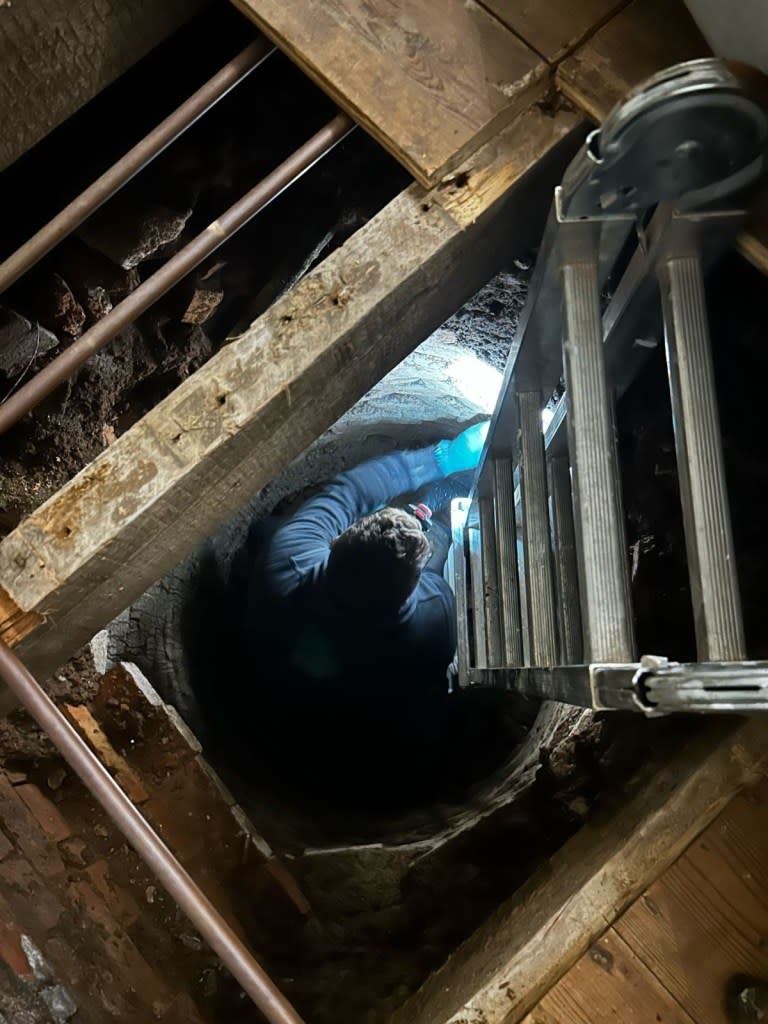 While lifting the floorboards to replace the boiler last month, the couple was shocked to find a ring of bricks with a deep pit in the middle, in front of the bay window. Shaniah Lloyd / SWNS