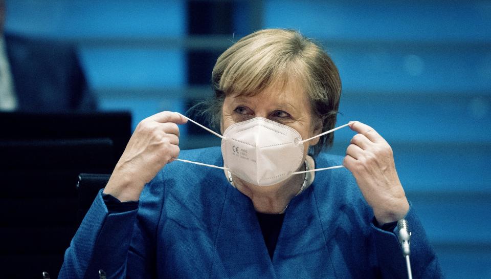 German Chancellor Angela Merkel wears a face mask as she arrives for the weekly cabinet meeting at the Chancellery in Berlin, Germany, Wednesday, Oct. 28, 2020. (Kay Nietfeld/dpa via AP, pool)