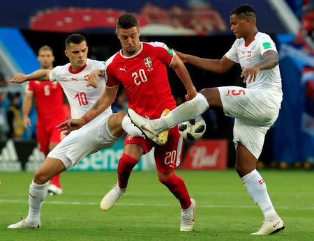 Soccer Football - World Cup - Group E - Serbia vs Switzerland - Kaliningrad Stadium, Kaliningrad, Russia - June 22, 2018 Serbia's Sergej Milinkovic-Savic in action with Switzerland's Granit Xhaka and Manuel Akanji REUTERS/Gonzalo Fuentes