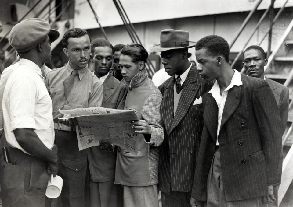 Some of the first immigrants from the Caribbean island of Jamaica arrive at Tilbury, London, on board the