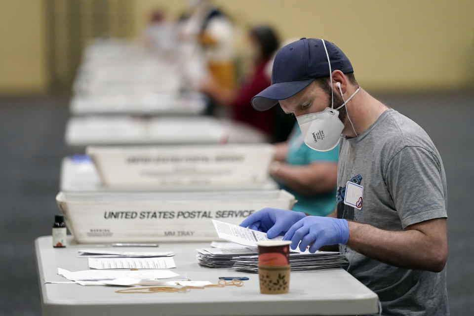 Workers prepare mail-in ballots for counting on Wednesday at the convention center in Lancaster, Pa. (Julio Cortez/AP)