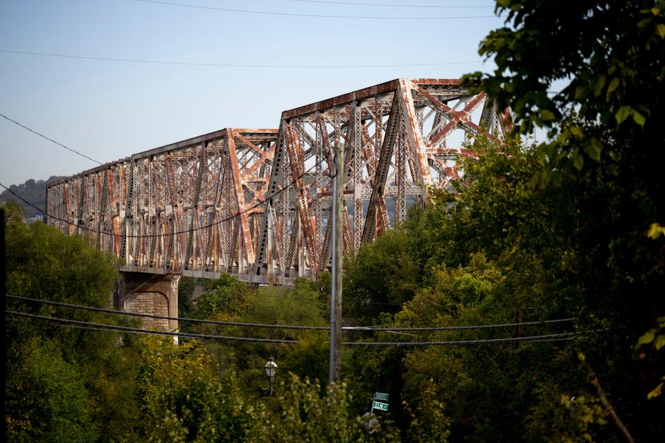 The Cincinnati Southern Bridge carries the Cincinnati Southern Railway tracks over the Ohio River into Ludlow, Kentucky. The structure's fading paint is visible from the Ludlow Trainwatching Platform.