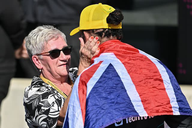 <p>Vince Mignott/MB Media/Getty</p> Lewis Hamilton elebrates his win in with his mother Carmen Larbalestier during the F1 Grand Prix of Great Britain at Silverstone Circuit on July 7, 2024 in Northampton, England.