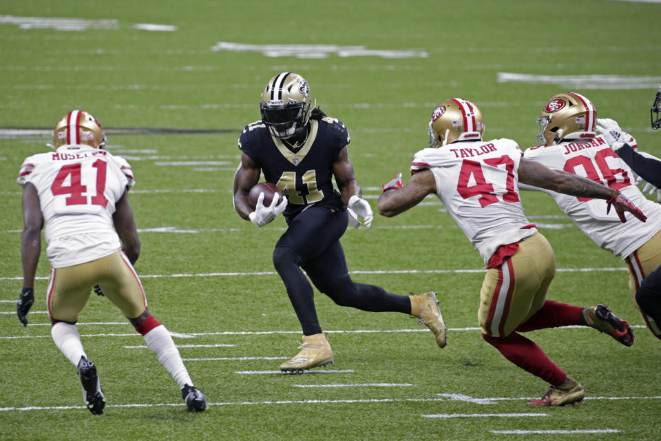 New Orleans Saints running back Alvin Kamara (41) is pursued by San Francisco 49ers cornerbacks Jamar Taylor (47), Emmanuel Moseley (41) and defensive end Dion Jordan in the first half of an NFL football game in New Orleans, Sunday, Nov. 15, 2020. (AP Photo/Butch Dill)
