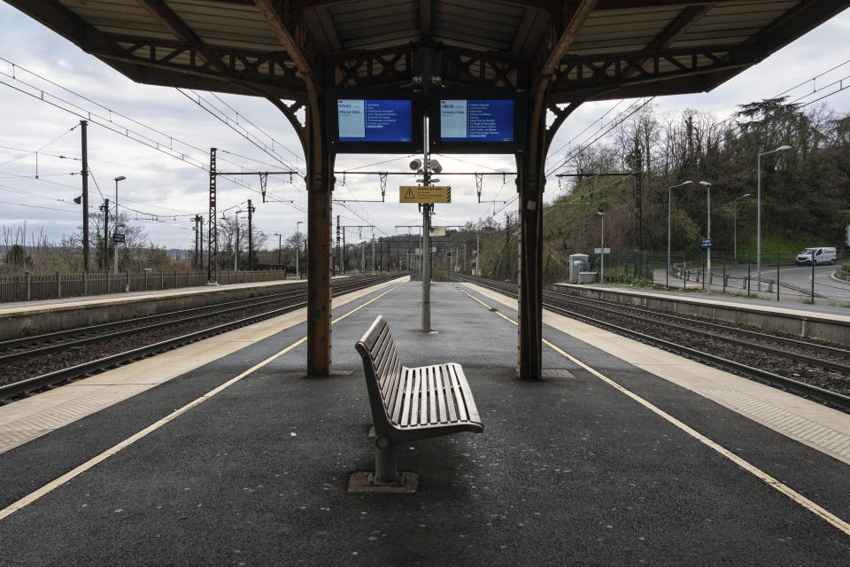 An empty platform is pictured during a railway strike at the Saint Germain au Mont d'Or train station, around Lyon, central France, Monday, Dec. 9, 2019. French commuters inched to work Monday through exceptional traffic jams, as strikes to preserve retirement rights halted trains and subways for a fifth straight day. Citing safety risks, the SNCF national rail network issued warned travelers to stay home or use "alternate means of locomotion" to get to work Monday instead of thronging platforms in hopes of getting the few available trains. (AP Photo/Laurent Cipriani)