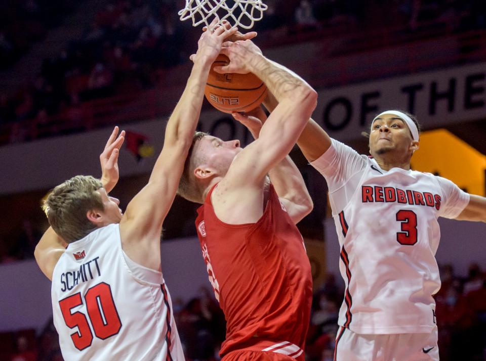 ISU's Ryan Schmitt (50) and Howard Fleming Jr. (3) battle for a rebound with Bradley's Rienk Mast in the second half Sunday, Jan. 16, 2022 at Redbird Arena. The Braves fell to the Redbirds 74-65.