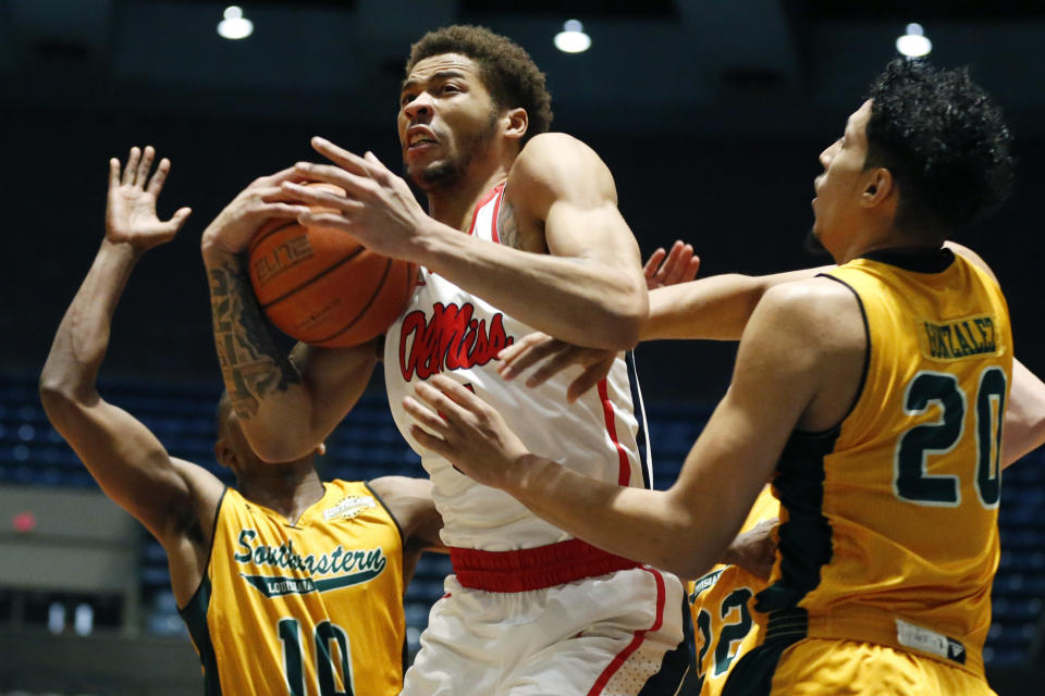 Mississippi forward KJ Buffen (5) protects a rebound from Southeastern Louisiana forward Brandon Gonzalez (20) and guard Von Julien (10) during the first half of an NCAA college basketball game, Saturday, Dec. 21, 2019, in Jackson, Miss. Mississippi won 83-76. (AP Photo/Rogelio V. Solis)