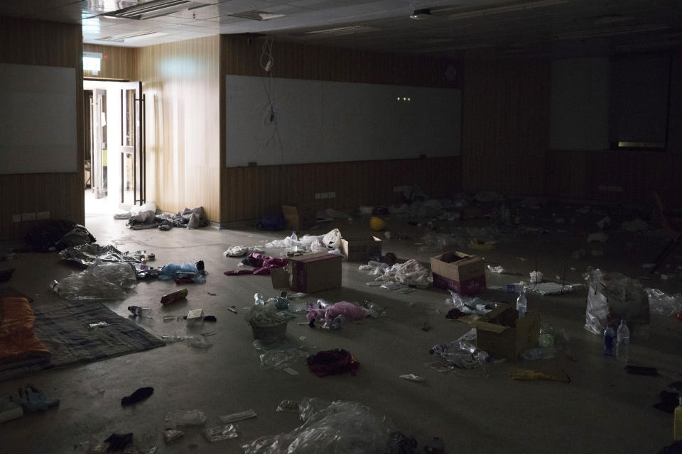 In this Friday, Nov. 22, 2019, photo, belongings of anti-government protesters are left at a gymnasium at the Hong Kong Polytechnic University campus in Hong Kong. Most of the protesters who took over the university have left following clashes with police, but an unknown number have remained inside, hoping somehow to avoid arrest. (AP Photo/Vincent Thian)