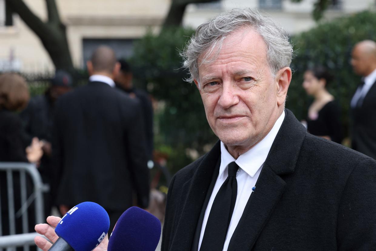 French actor Francis Huster talks to the press as he arrives for the funeral ceremony for late French actor Jean-Paul Belmondo at the Saint-Germain-des-Pres church in Paris on September 10, 2021. - Several hundred of attendees have gathered to pay their respects to one of the most popular French actors on September 9, 2021: his relatives, the French President and members of the government as well as personalities from the world of cinema, culture and sport. Belmondo died on September 6, 2021 aged 88. (Photo by Thomas COEX / AFP) (Photo by THOMAS COEX/AFP via Getty Images)