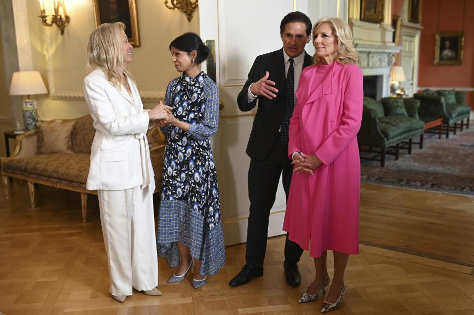 Akshata Murty, wife of Britain's Prime Minster, second left, and US First Lady Jill Biden, right, meet with US ambassador to the UK Jane Hartley, lefr, and Britain's Conservative Party MP Johnny Mercer inside 10 Downing Street in central London, Friday, May 5, 2023. (Oli Scarff/Pool Photo via AP)